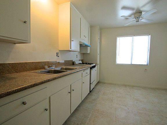 Kitchen with new granite countertops and tile flooring