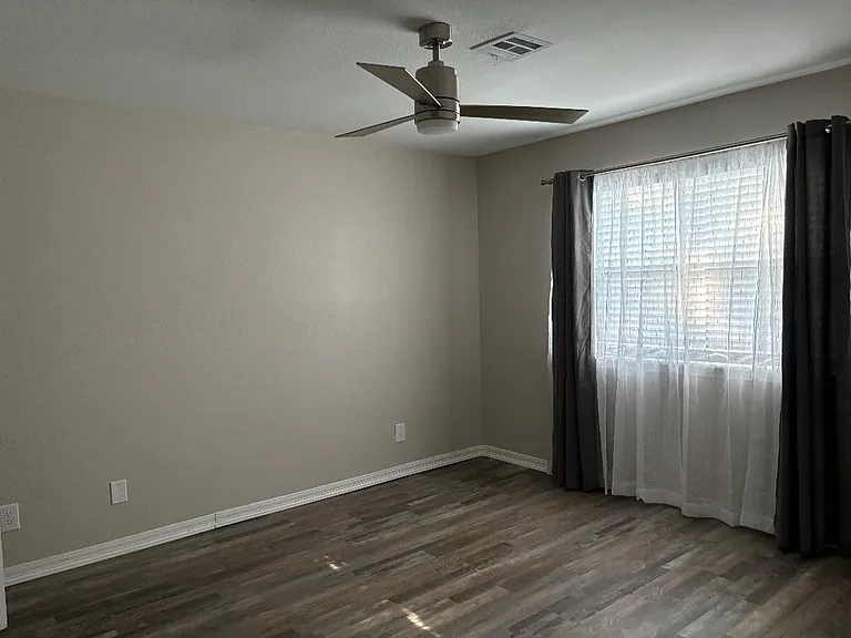 Master bedroom curtain/sheers and blinds.
