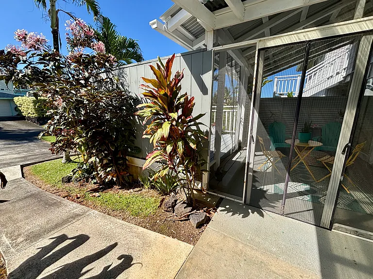 Private covered entry accessed from private driveway parking.