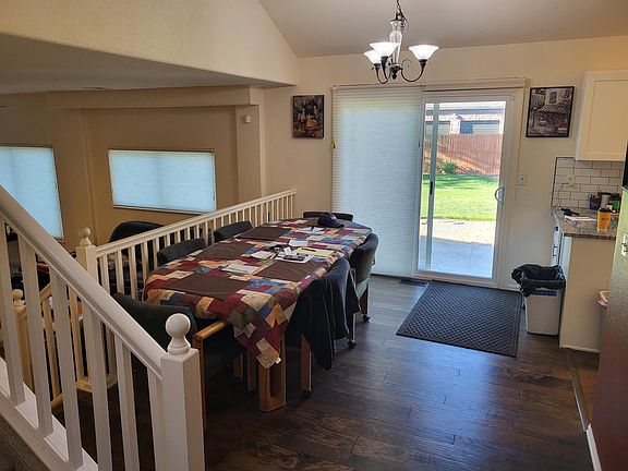 Dining room - new wood floor, paint and window coverings on the sliding glass door