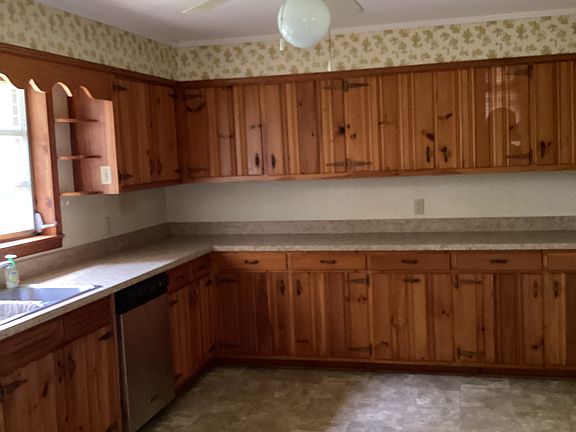 Kitchen. Stove, refrigerator, dishwasher provided. New countertops and vinyl flooring.