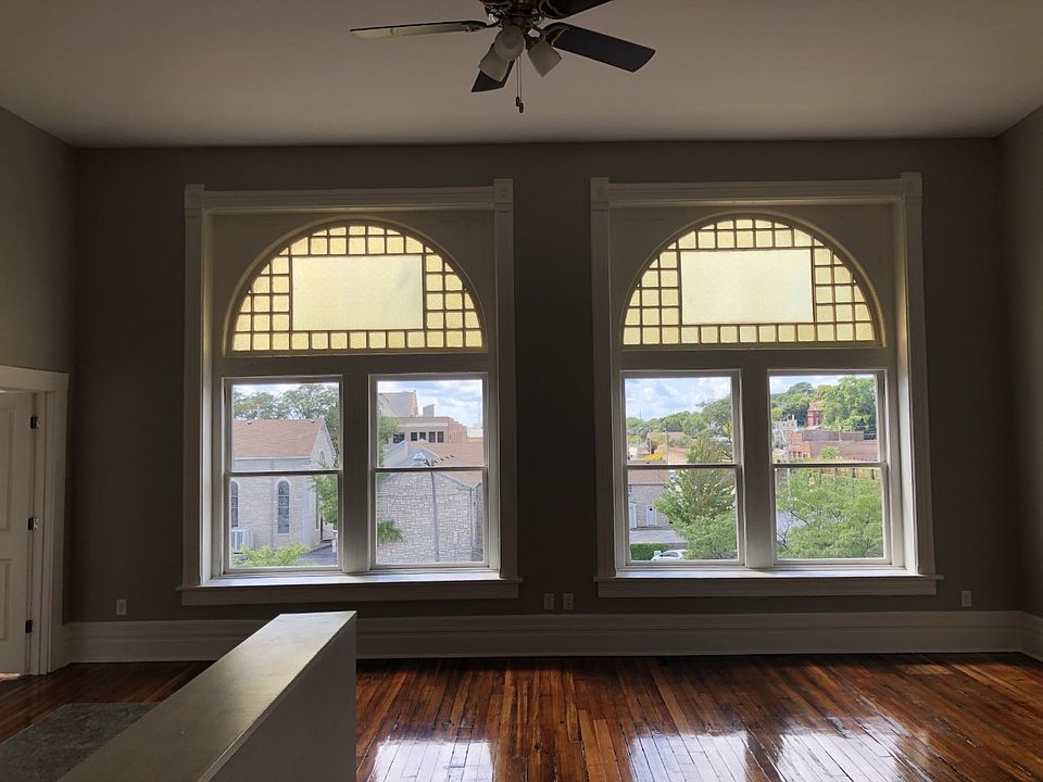 Large3 open living room with beautiful windows that allow bring in tons of natural light.