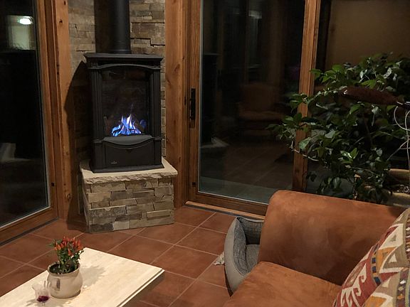 Gas stove in garden room.