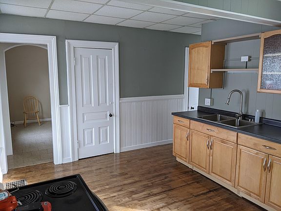 Kitchen, looking into living room through left doorway