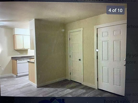 Front entry door + closet in LR area, looking toward kitchen