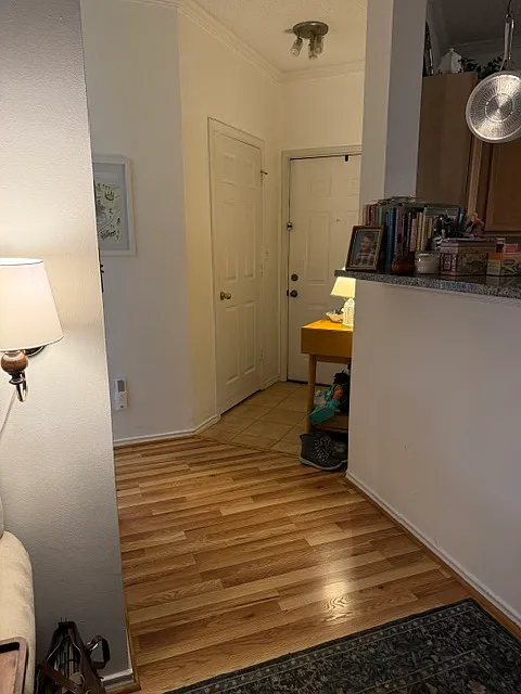 A view of the front door from the living room. - 4435 Fair Stone Dr #103