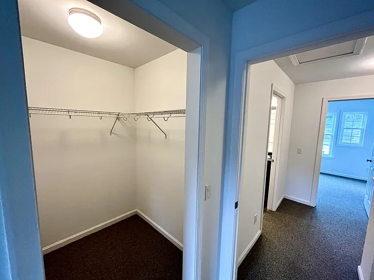 Hallway into primary bedroom