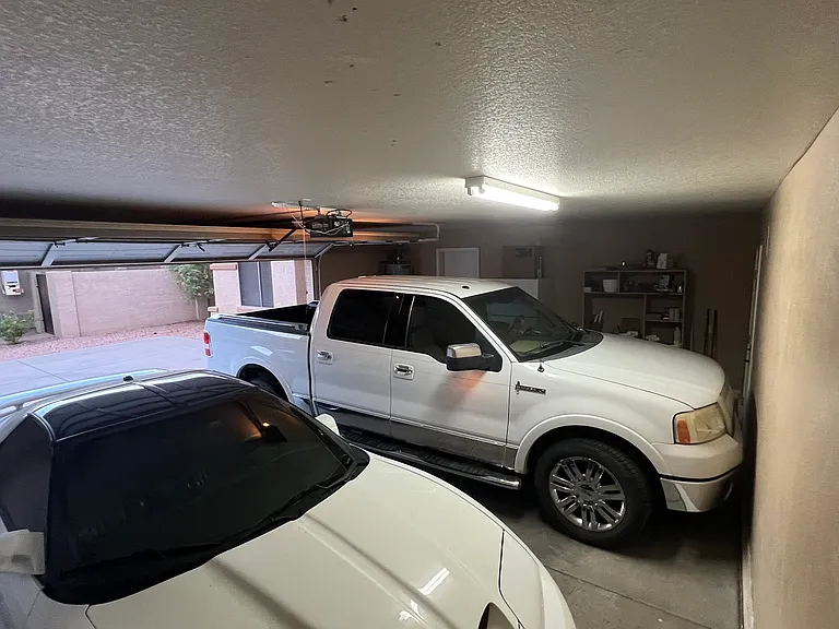 2.5 car garage which has a sink and back door to trash and RV gate and fits trucks with hitch (big trucks require measuring & some effort like using a ball on string that hangs down onto windshield from ceiling). Extra Refrigerator and freezer in garage.