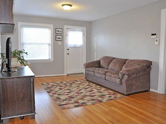 Beautiful hardwood floors throughout the living and dining room areas. Great ceiling height & tons o