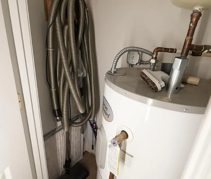 Closet with the central vacuum hose