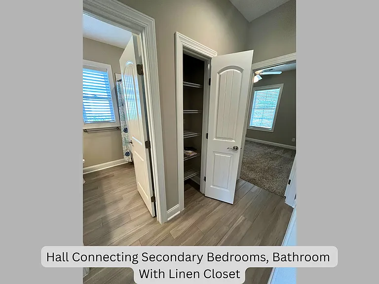 Hall connecting secondary bedrooms, bathroom with linen closet