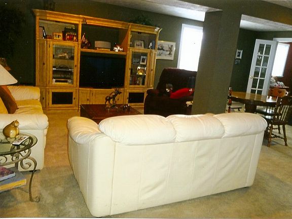 Cozy Lower Level Family Room
						:
						Daylight Windows, BR and 3/4 BA , Bar Area, Huge Room Wired For Surround Sound