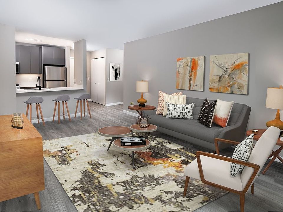 Renovated Package II living, dining, and kitchen areas with hard surface plank flooring