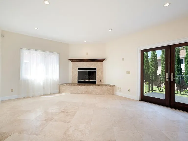 Large Family Room with French doors leading to the walk out View Terrace and big Backyard.