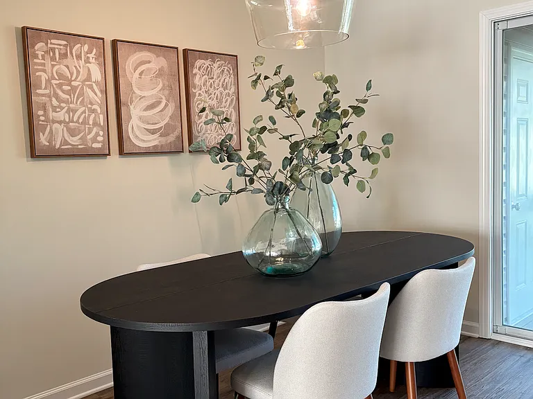 Staged dining area in model until, same floorpan and finishes
