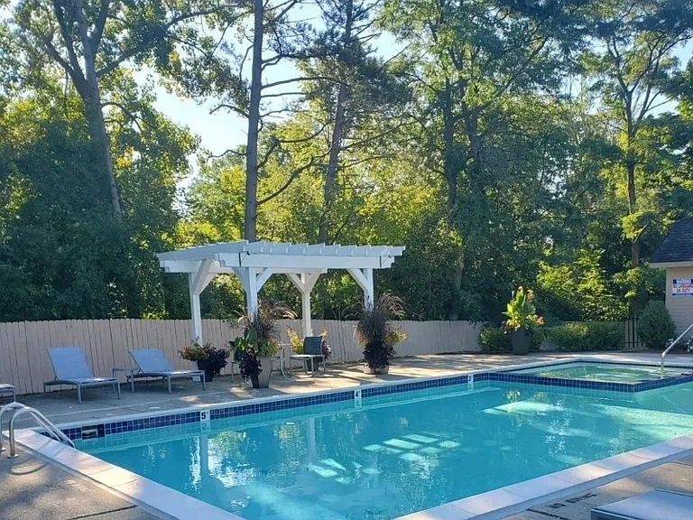 Refreshing pool on the beautifully landscaped grounds with sundeck.