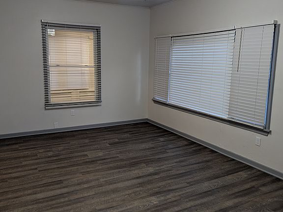 Large open living room with lots of windows and light!