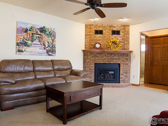 19x15 family room with brick gas fireplace.