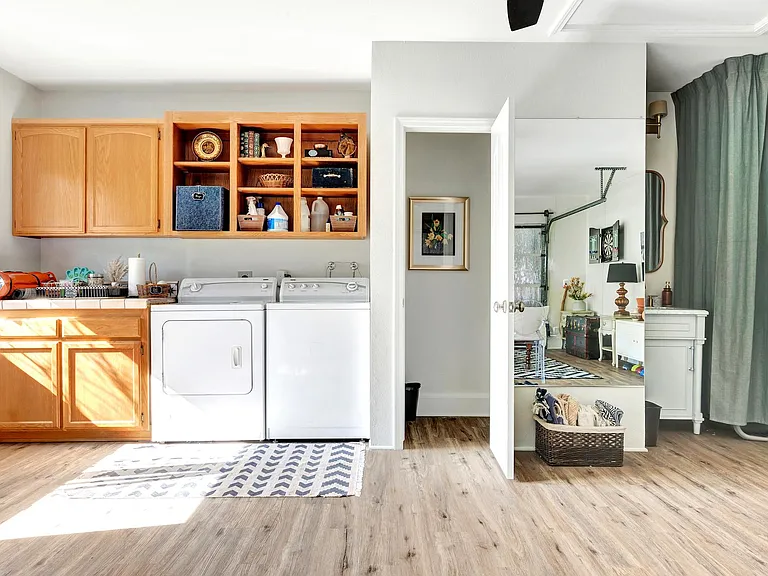 laundry and 1/2 bath, water closet + vanity in the converted garage.