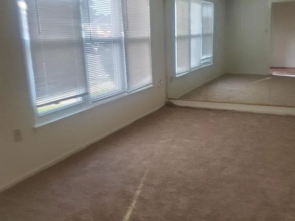 Living Room with Mirrored Wall