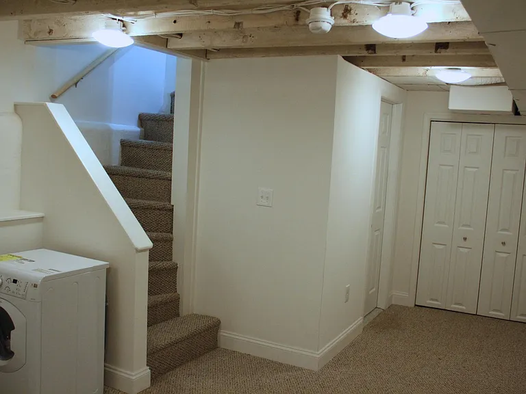 Basement/Man cave ( Washer not situated as pictured - it's hidden away behind a closet door.