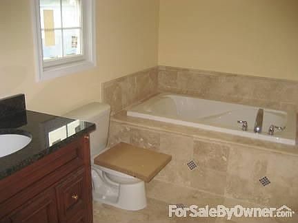 Masterbedroom
						:
						Sunk in Tub with also stand up shower across from vanity.