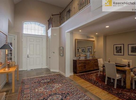 TWO STORY ENTRY, FRENCH DOORS TO THE 2ND BEDROOM/OFFICE. DINNING ROOM WITH HARDWOOD FLOORS