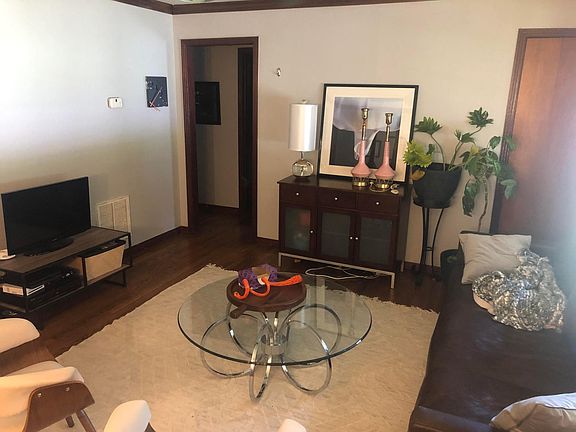 Living Room, Wood floors throughout. Large bay window