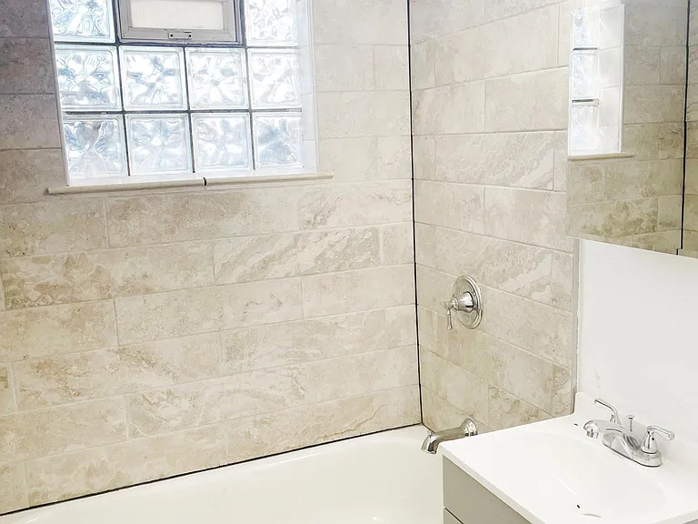 Brand-new bathroom with Moen shower set