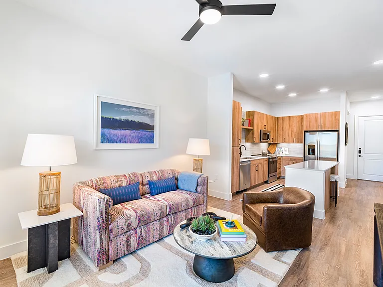Experience the allure of Modera Trinity's dynamic floor plans, where gourmet kitchens boast quartz countertops, 42-inch custom cabinetry, vibrant under-cabinet lighting, and an open layout that effortlessly flows into the living area.