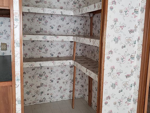 Nice lighted walk in pantry off dining area in the kitchen