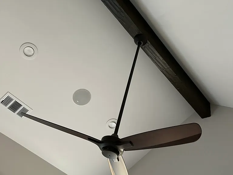 Master bedroom wood beam ceiling and fan accent.
