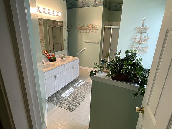 Master bathroom. Features dual sink, soaking tub and separate large shower