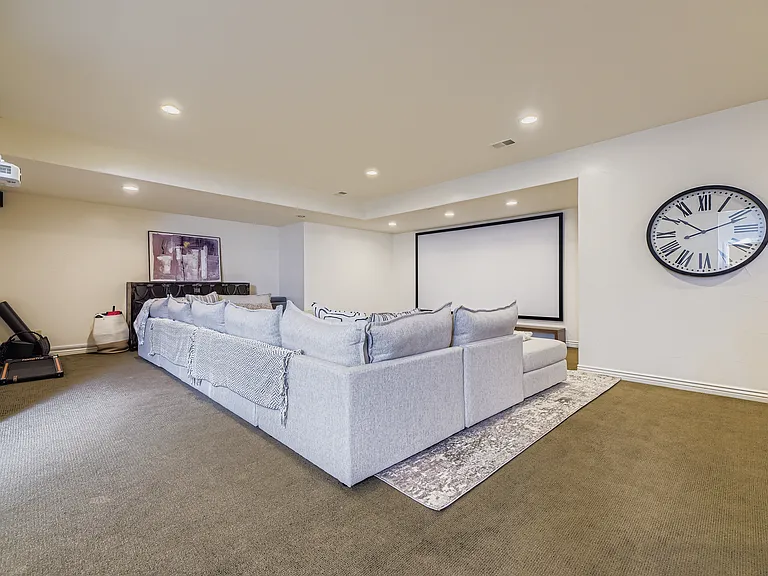 BASEMENT WITH HUGE SCREEN WITH PROJECTOR FOR WATCHING GAMES/MOVIES