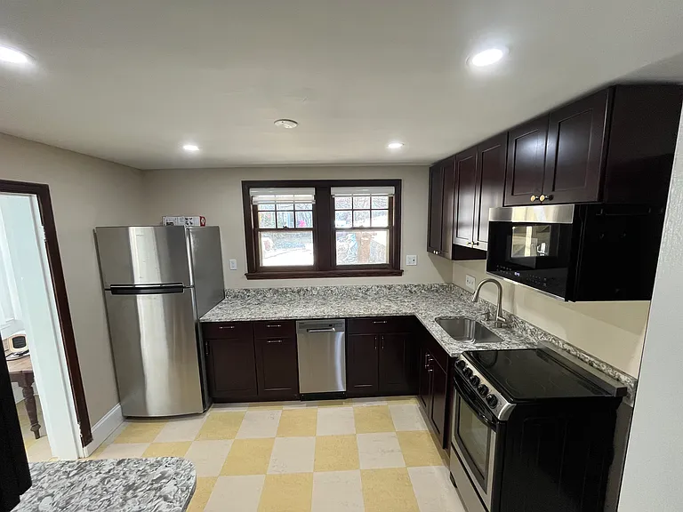 Well equipped kitchen with all new appliances includes double window into back yard.