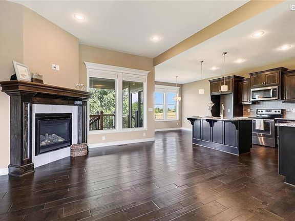 Gorgeous hardwoods throughout main living areas, tall ceilings and an open floor plan