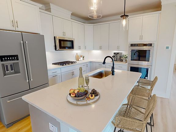 The kitchen of the Monroe by Brookfield Residential