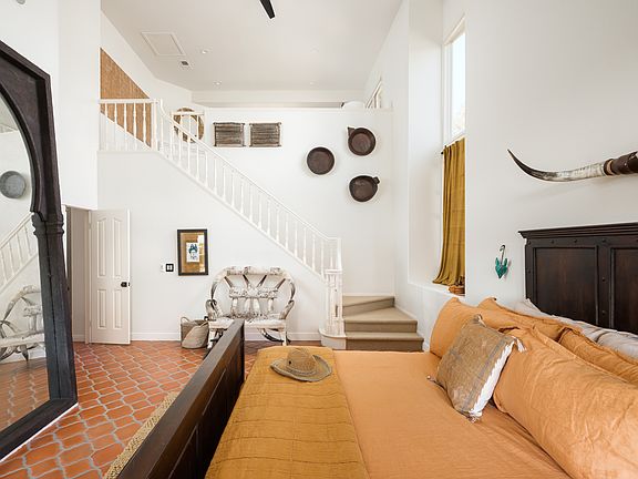 Primary Bedroom with upstairs loft & fireplace