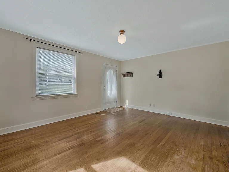 Photo 5. Living Room and front entrance