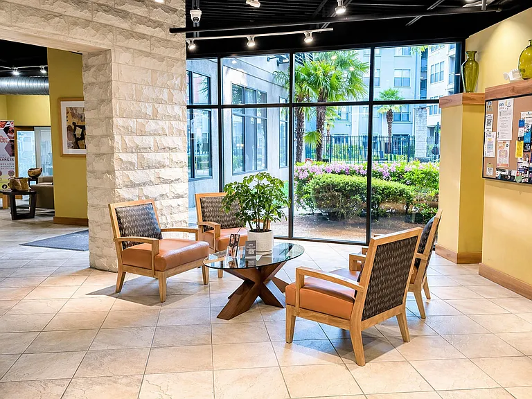 Stylish lobby seating area with four chairs_ideal for casual conversations or waiting comfortably