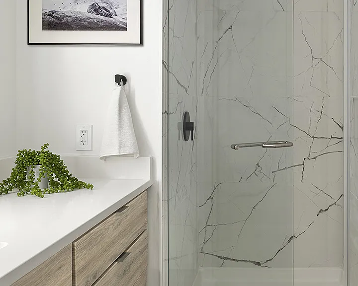 Apartment Bathroom with glass enclosed shower and hardwood flooring.