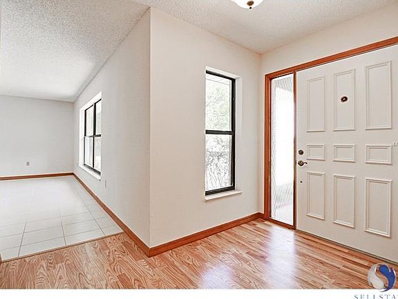 Entryway has Laminate Floor, leads to Living Room