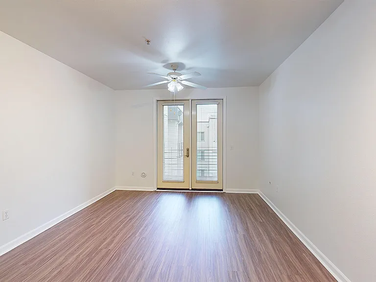 Apartment living room with wood-style flooring.