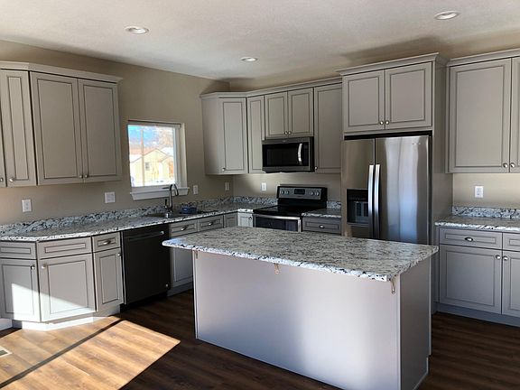 Kitchen with stainless steel appliances and granite counter tops.