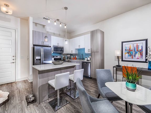 Mist kitchen design package with blue backsplash, tuxedo style cabinets in polished white and gray