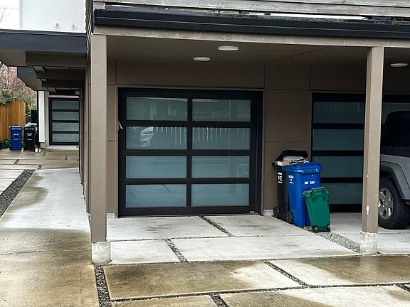 Lighted carport in front of garage