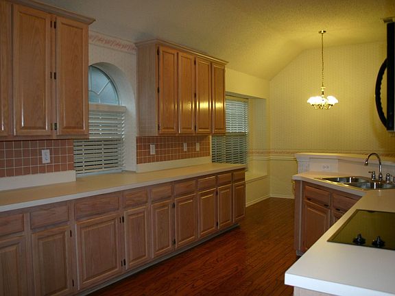 Kitchen opens up to breakfast room and den.
