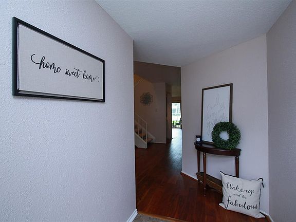 Upon entering you are greeted with fabulously updated tile and wood flooring!