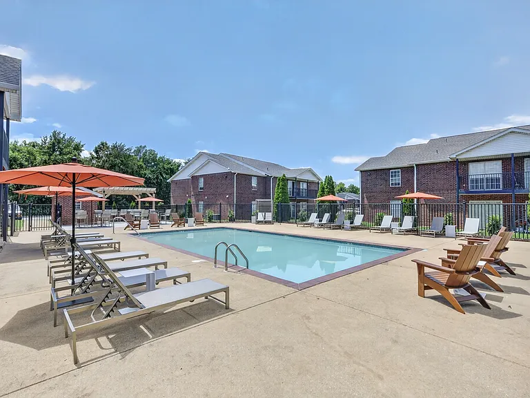 Modernized pool area offering a spacious sundeck and relaxing outdoor atmosphere.