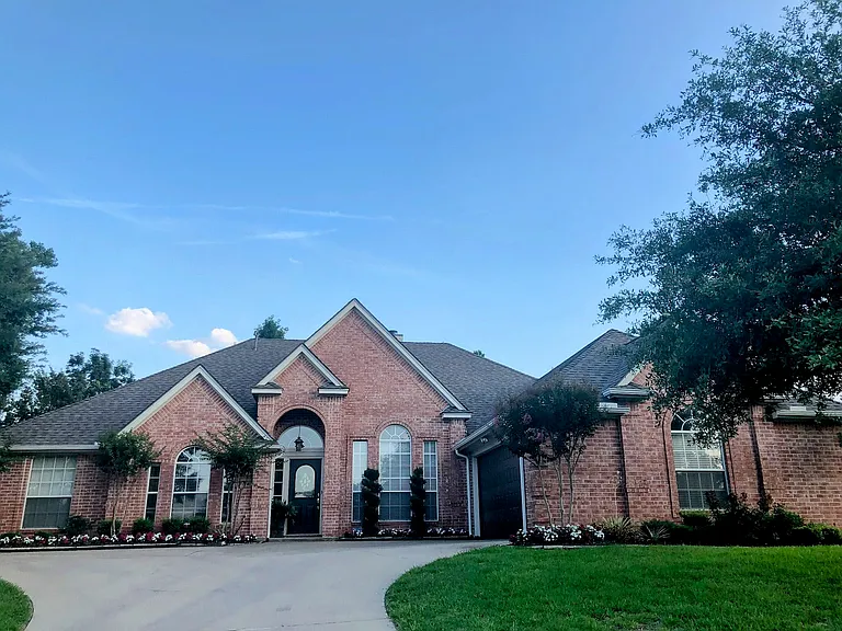 Front of House with attached two car garage.